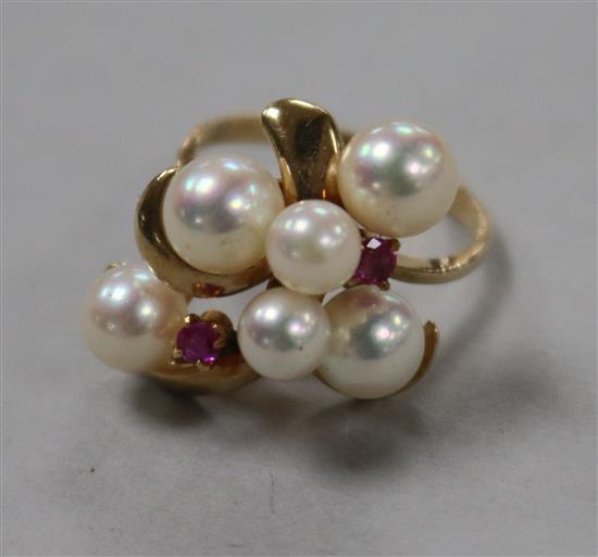 A 14k gold, cultured pearl and ruby cluster dress ring size J.